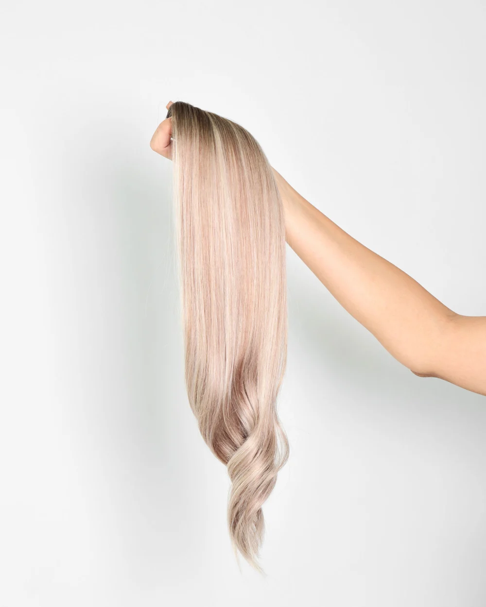 holding hair col 6 22 od display 20260908 Weft Extensions